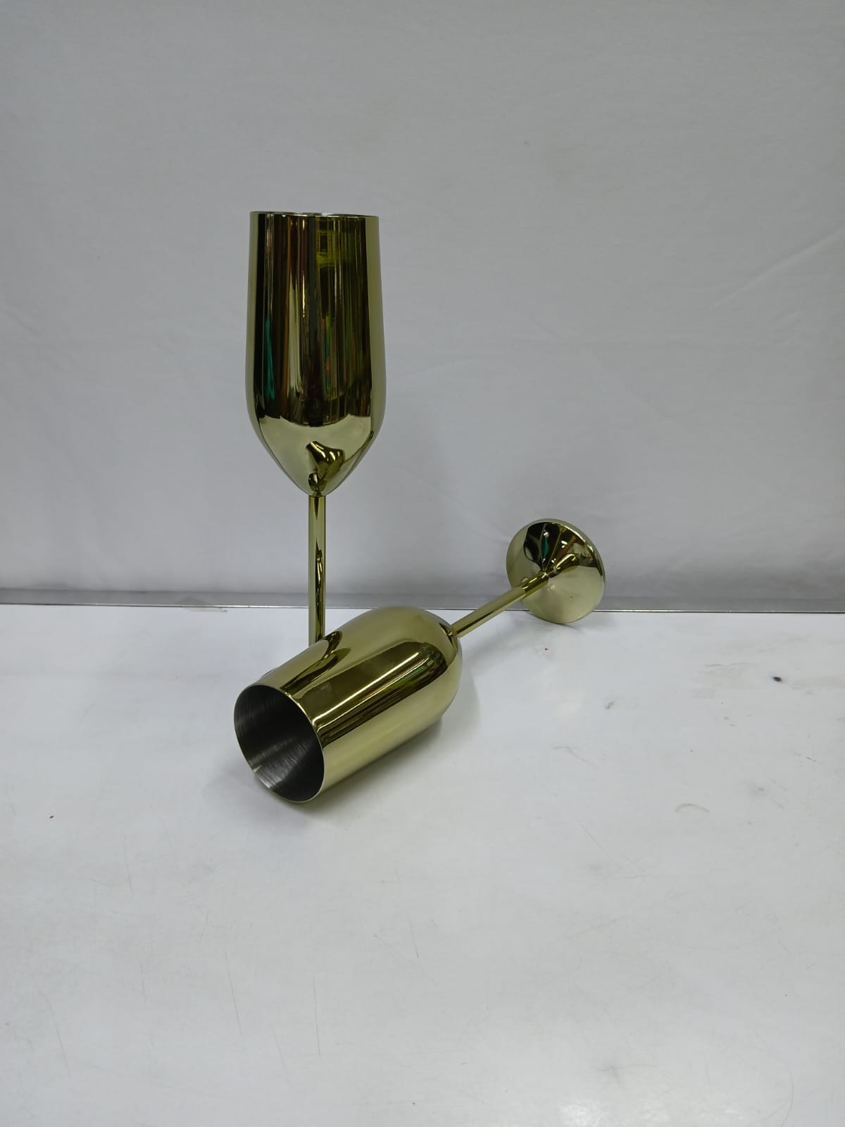 A pair of Gold Stainless steel wine glass